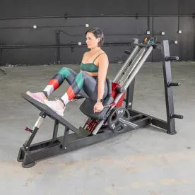 User Performing a Hack Squat on the Power Leverage V2 Hack Squat / Calf Raise Machine with Adjustable Foot Plate and Ergonomic Design. Weight Plates Not Included