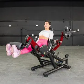 User Performing a Seated Leg Extension Exercise on the Power Leverage V2 Leg Extension / Leg Curl Combo, Targeting Quadriceps Muscles. Weight Plates Not Included