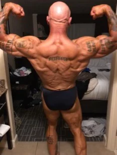 Jim Steel posing before his 2019 bodybuilding competition