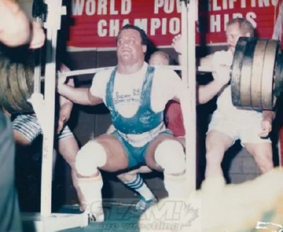 Doug Furnas performing a heavy barbell squat