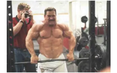 Kirk Karwoski performing barbell shrugs