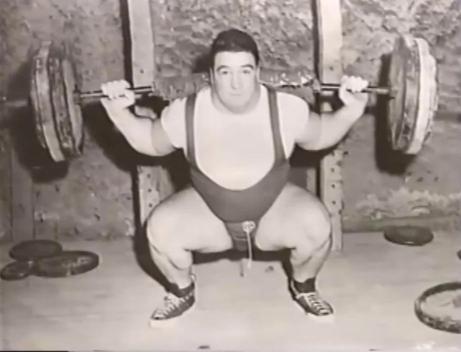 Paul Anderson performing a deep barbell squat