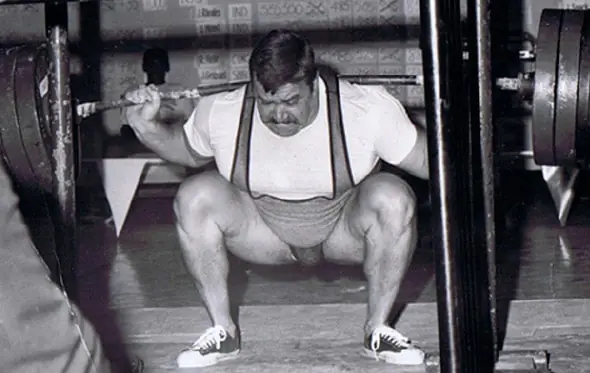 Hugh Cassidy performing a deep barbell squat