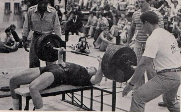 Mike MacDonald performing a paused bench press
