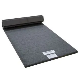 A charcoal gray carpeted gymnastics and cheer mat available in 3' x 6' and 5' x 10' sizes, featuring high-impact sports foam and a durable 26 oz. carpet surface for safe tumbling and training.