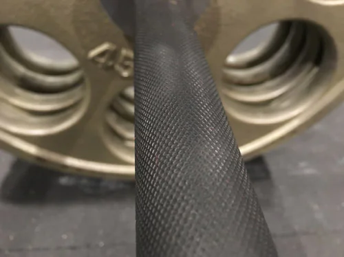 Close-up of Olympic bar diamond knurling