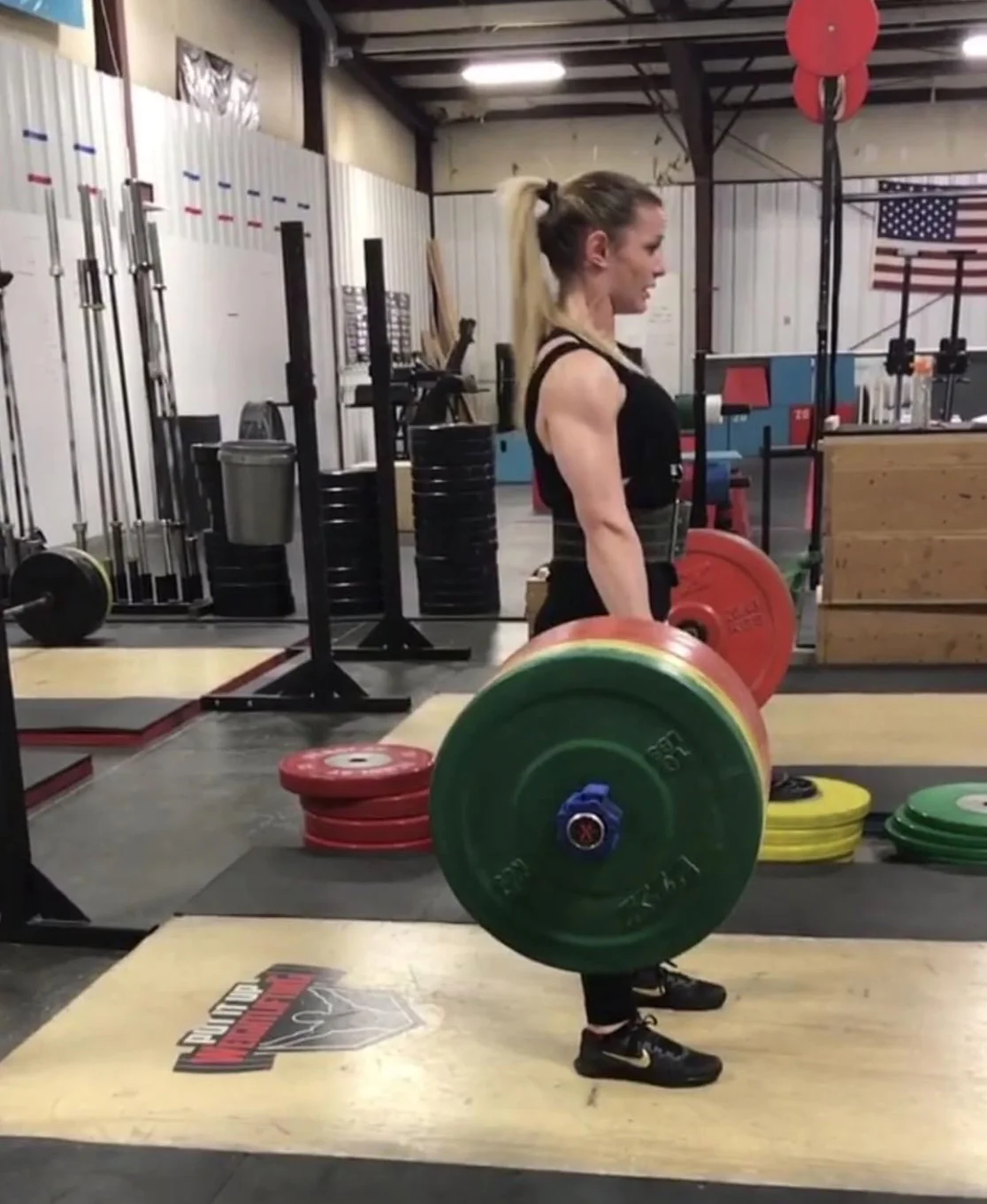 Athlete performing deadlifts in CrossFit-style training