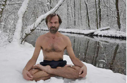 Man sitting in snowy woods for breathing and cardio