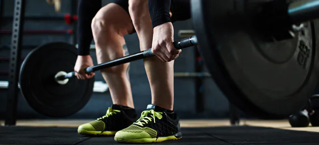 Athlete strength training with free weights