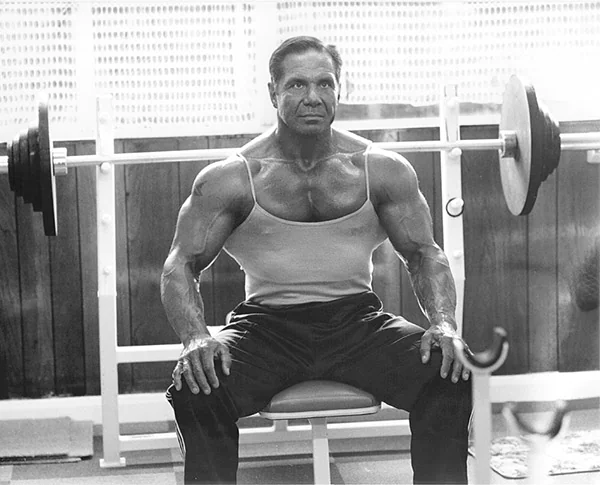 Athlete preparing for a flat bench press in the gym