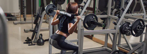 Athlete performing a barbell back squat