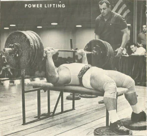 Mel Hennessy performing a competitive bench press