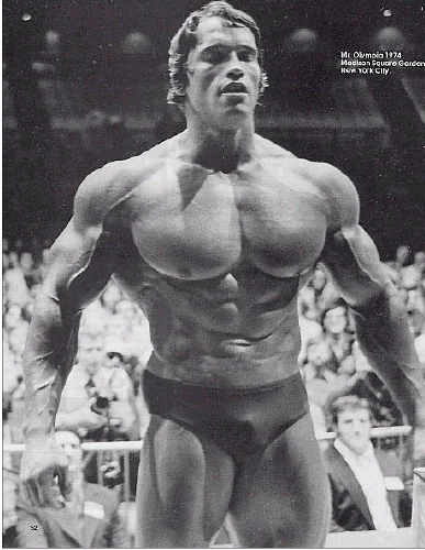 Arnold Schwarzenegger posing at a bodybuilding competition