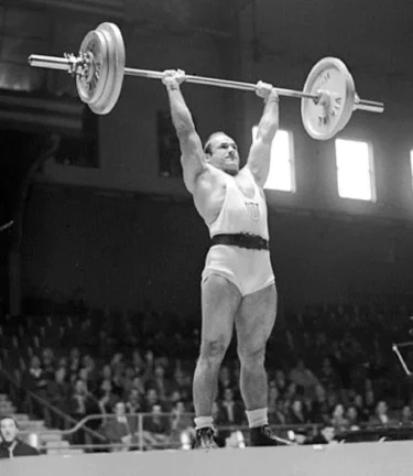 Athlete competing in an Olympic weightlifting competition