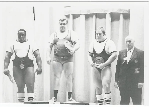 Image shows powerlifting champion Hugh Cassidy receiving an award at a powerlifting meet.