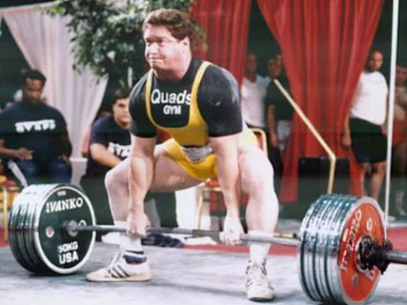 Ed Coan performing a heavy deadlift at a powerlifting meet