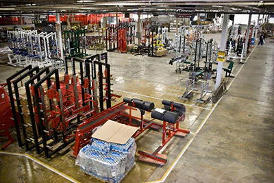 Staging area featuring IRON COMPANY strength equipment prepared for shipment to government and military facilities across the United States under GSA contract 47QSMA22D08NN.