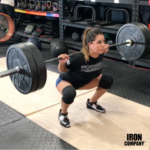 Athlete performing a barbell back squat for core strength