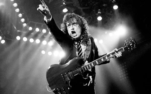 Music artist performing live on stage during a concert