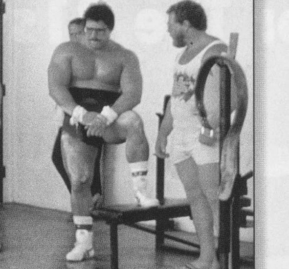 Two men training for a powerlifting competition