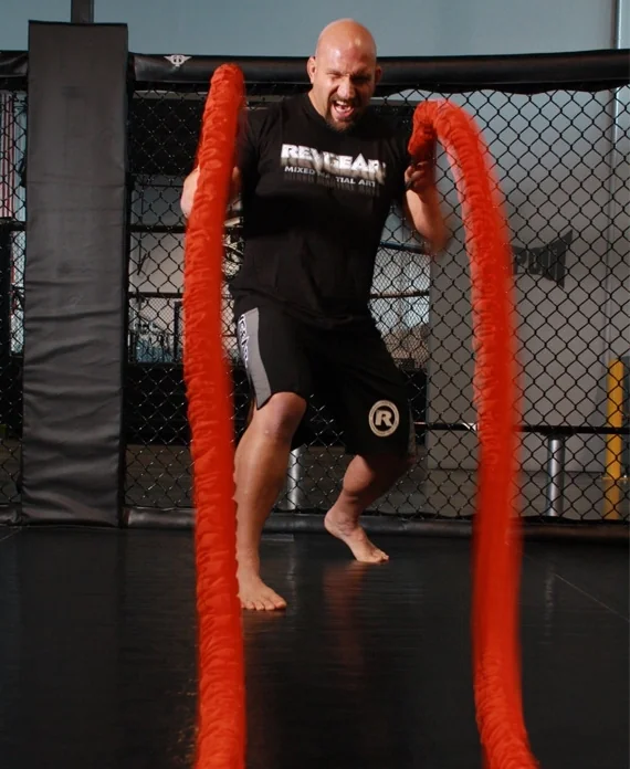Athlete training with Stroops battle ropes