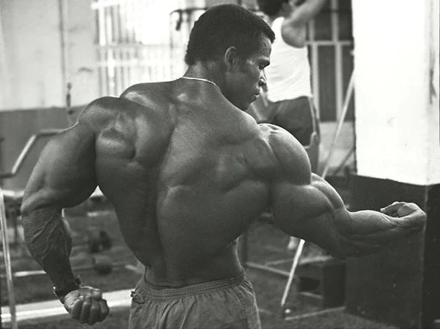 Athlete flexing upper body muscles after resistance training