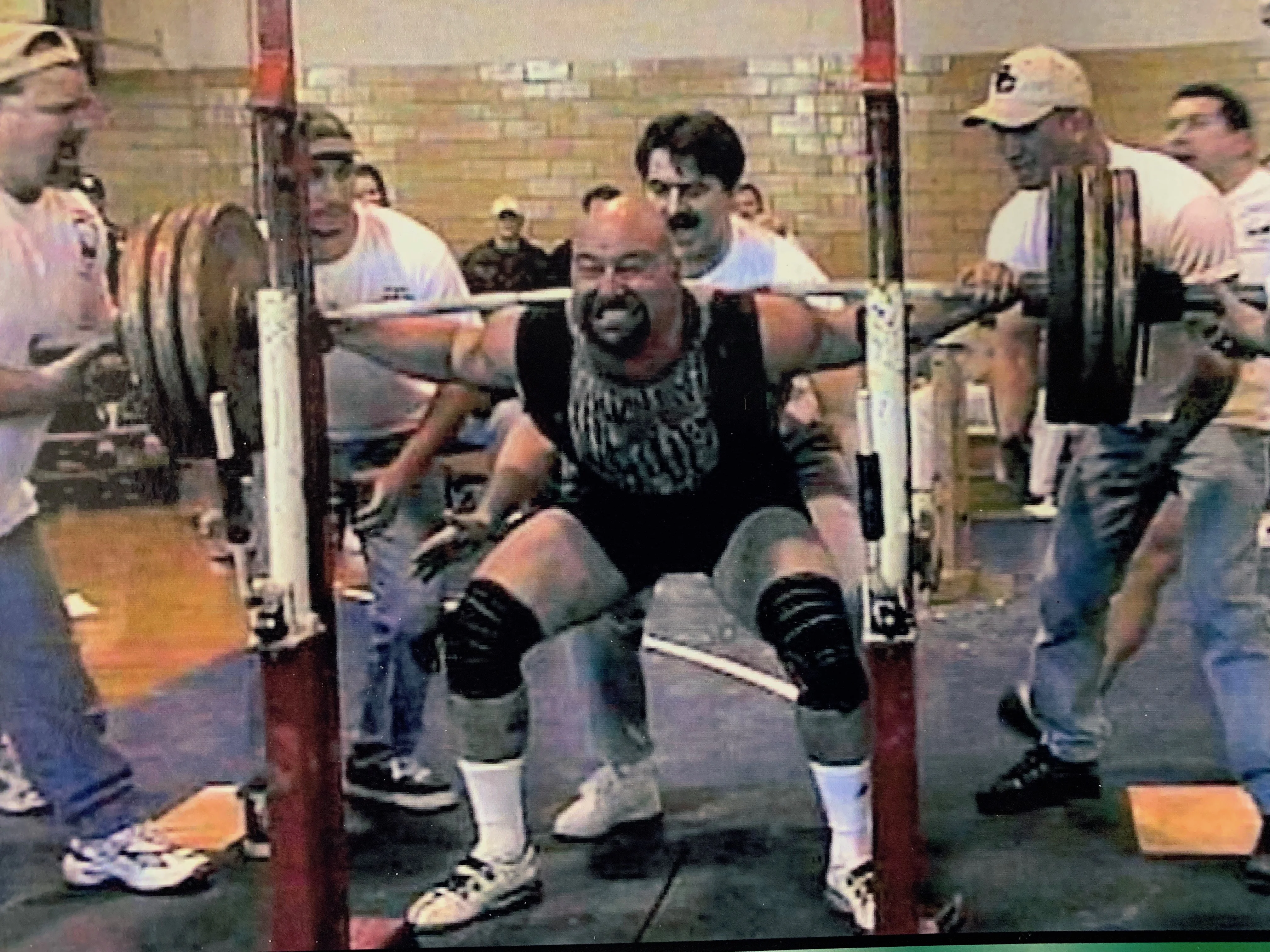 Athlete performing a barbell back squat