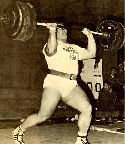 Ken Patera performing an overhead barbell press
