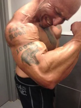 Athlete flexing his bicep muscle
