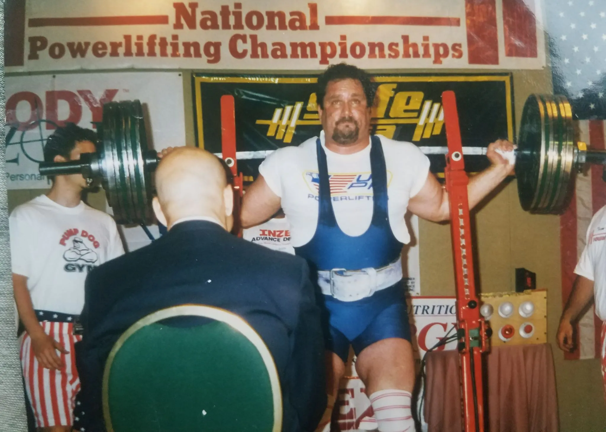 Bob Nacho Del Grande Myers performing a heavy barbell squat