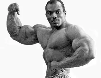 Sergio Oliva displaying massive bodybuilding arms