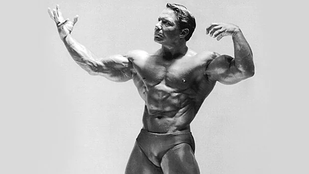 Bodybuilding Legend Bill Pearl displaying his massively muscular biceps and triceps muscles.