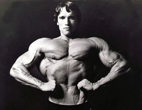 Arnold Schwarzenegger posing during the Pumping Iron era