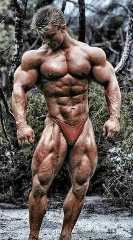 Competitive bodybuilder posing in a lean off-season condition