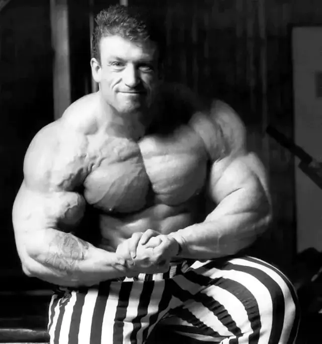 Dorian Yates flexing arm and chest muscles