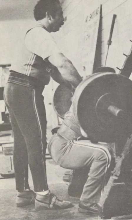 George Frenn spotting Roger Estep during a heavy barbell squat