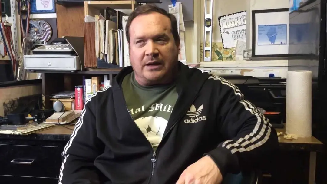 Ed Coan teaching powerlifting technique at a strength seminar