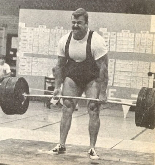 Hugh Cassidy performing a heavy barbell deadlift