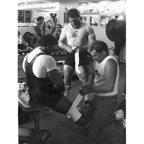 IRON COMPANY athlete Marty Gallagher after performing barbell squats shown with powerlifting champion Mark Chaillet.