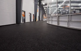 Durable Regupol Aktiv Rolled Rubber Flooring installed in an ice rink, providing slip-resistant, impact-absorbing protection for skaters and athletes.