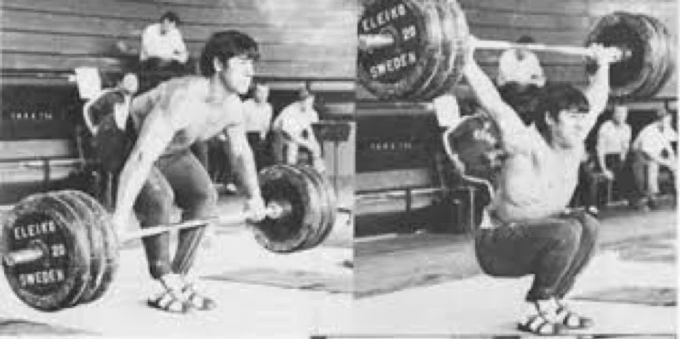 Weightlifter David Rigert snatching barbell