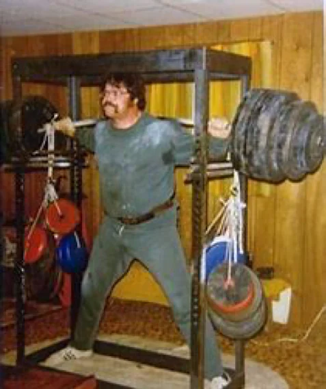 Gale Gillingham performing a heavy barbell squat