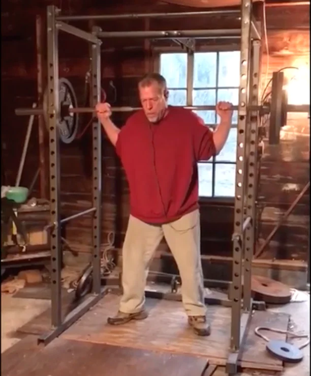 Marty Gallagher performing a barbell squat
