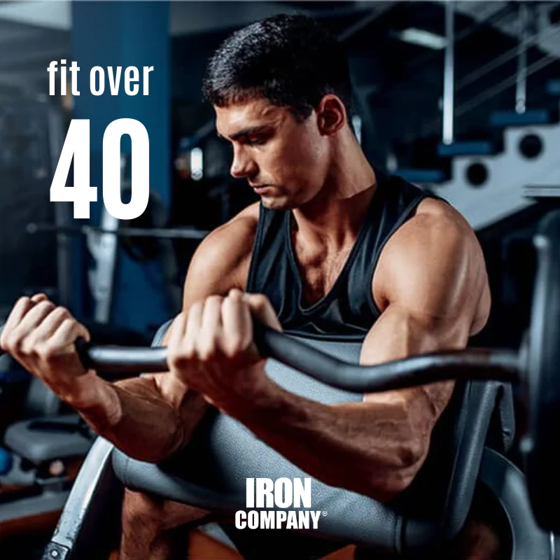 Athlete over 40 performing a preacher curl
