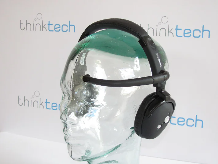 Black headset with forehead sensor on a glass display head