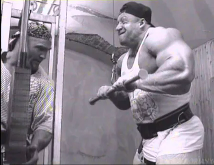 Bodybuilder and training partner during forced-rep work