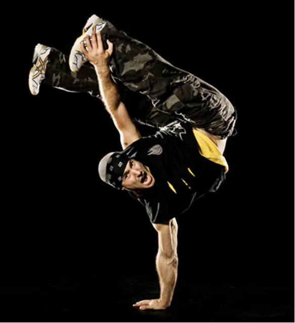 Television character break dancing in a comedy scene